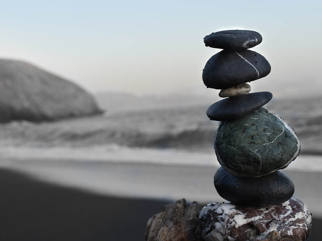 Neatly stacked pile of smooth stones